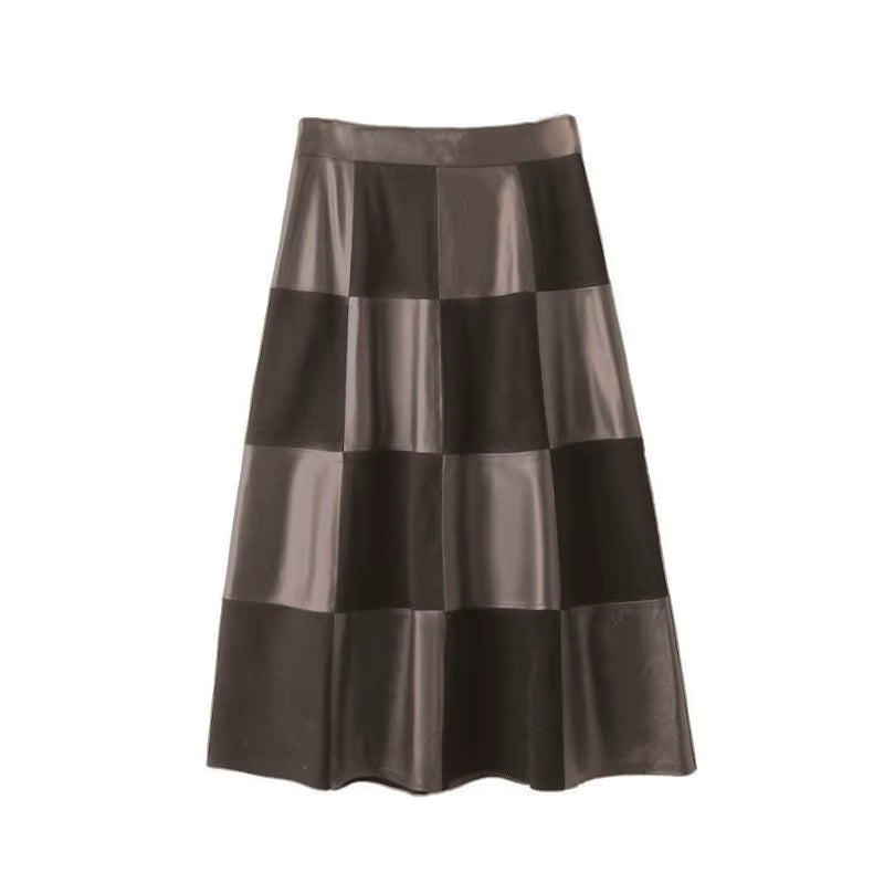 Black and brown leather maxi skirt with a checkerboard pattern and high-waisted A-line silhouette.